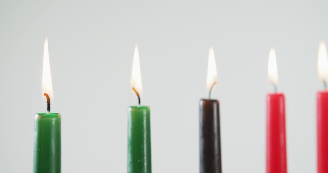 Lit Candles for Kwanzaa Celebration on White Background - Free Images, Stock Photos and Pictures on Pikwizard.com