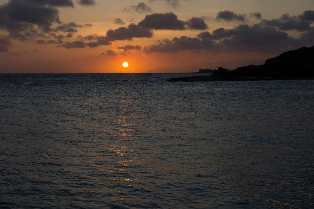 Serene Tropical Sunset Over Calm Ocean Waters - Free Images, Stock Photos and Pictures on Pikwizard.com