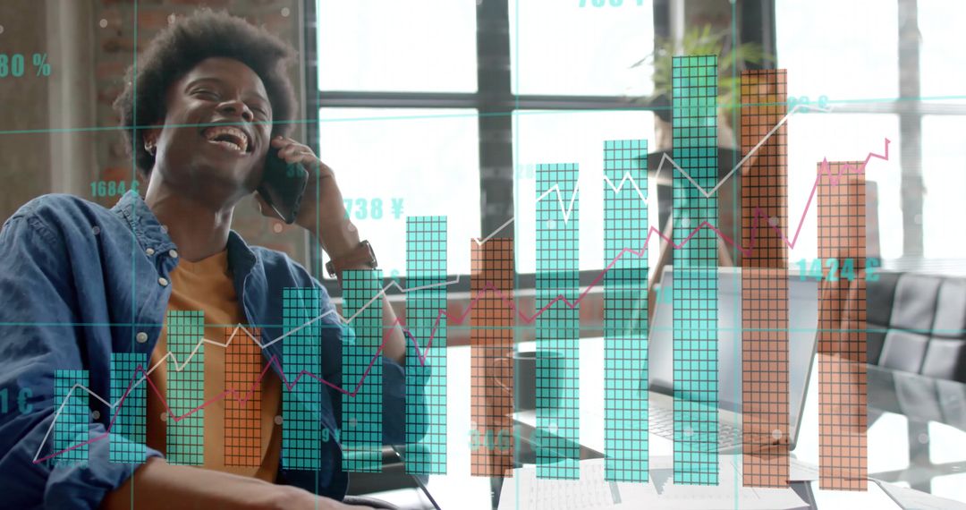 Smiling Businessman Analyzing Financial Graphs in Modern Office
