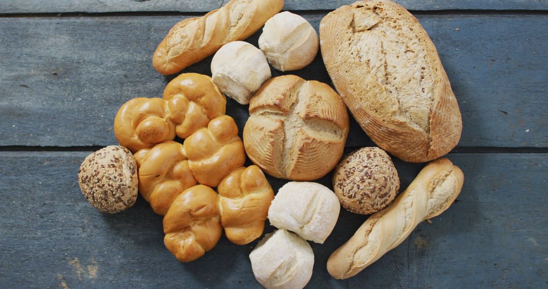 Assorted Freshly Baked Artisan Breads on Rustic Table