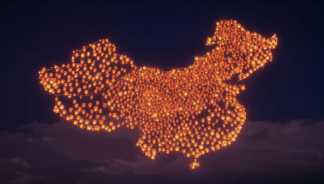 Sky Lanterns Forming the Shape of China in Starry Night