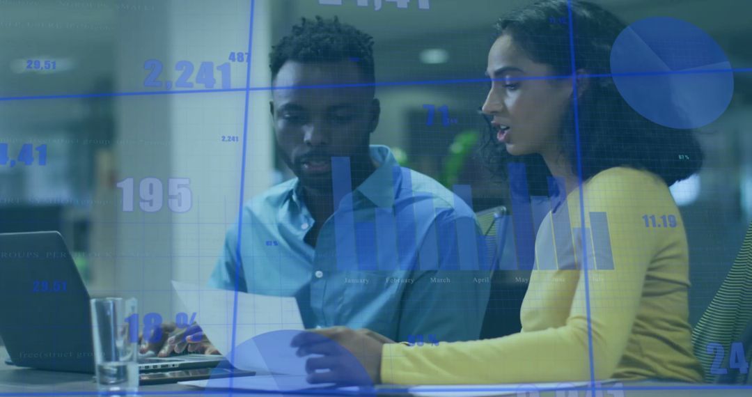 Business Colleagues Analyzing Financial Data Overlaid on Charts