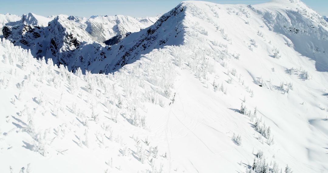 Aerial View of Snow-Covered Mountain Range on a Clear Day - Free Images, Stock Photos and Pictures on Pikwizard.com