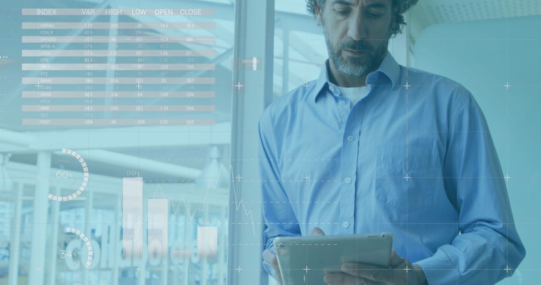 Focused Businessman Reviewing Financial Data on Tablet