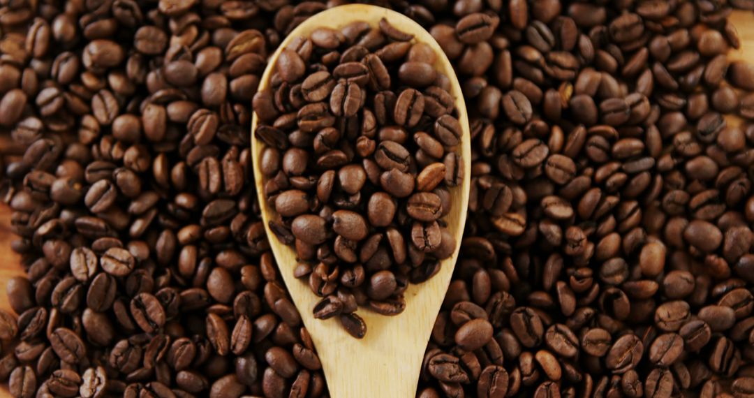 Wooden Spoon with Roasted Coffee Beans - Free Images, Stock Photos and Pictures on Pikwizard.com