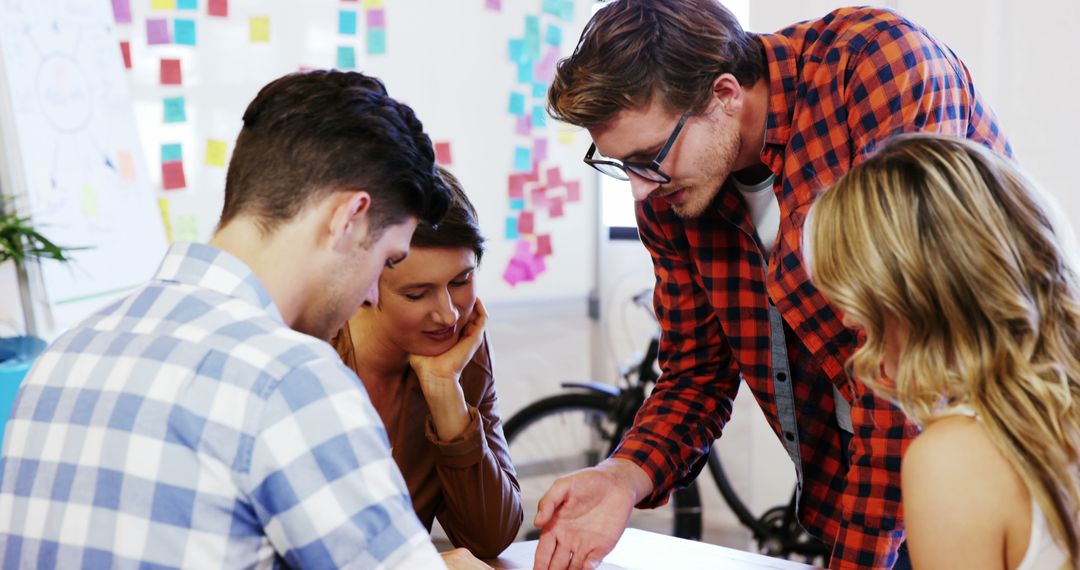 Collaborative Team Working on Creative Project in Modern Office