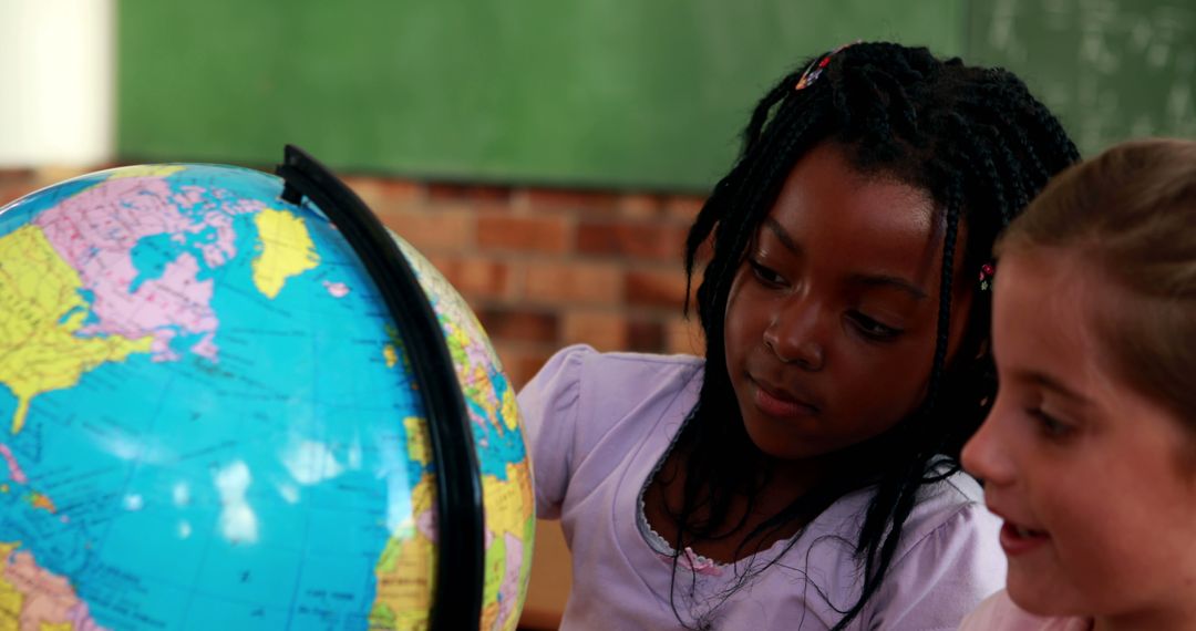 Children Exploring Globe in Classroom Setting - Free Images, Stock Photos and Pictures on Pikwizard.com