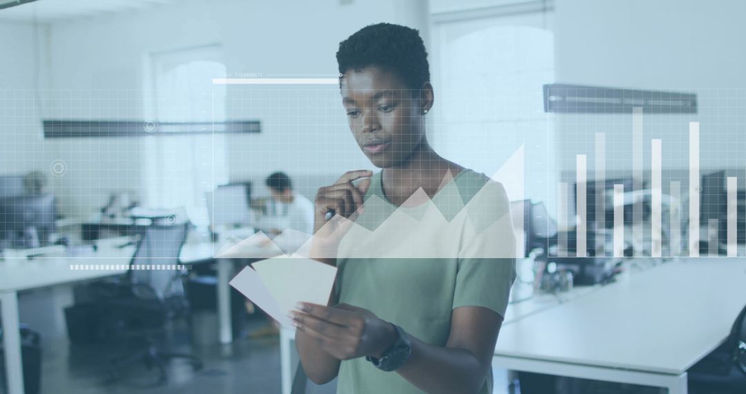 Professional Woman Analyzing Data in a Modern Office Environment