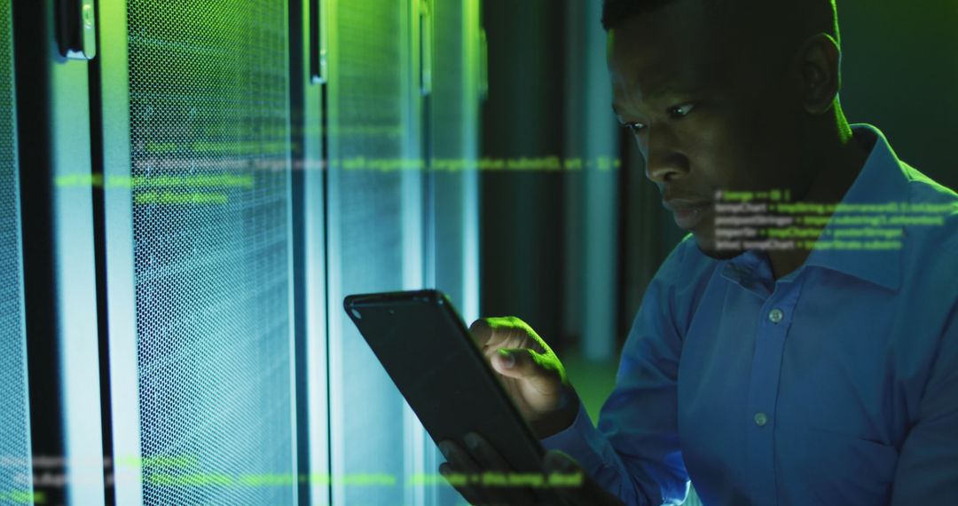Engineer using digital tablet amidst data processing in server room