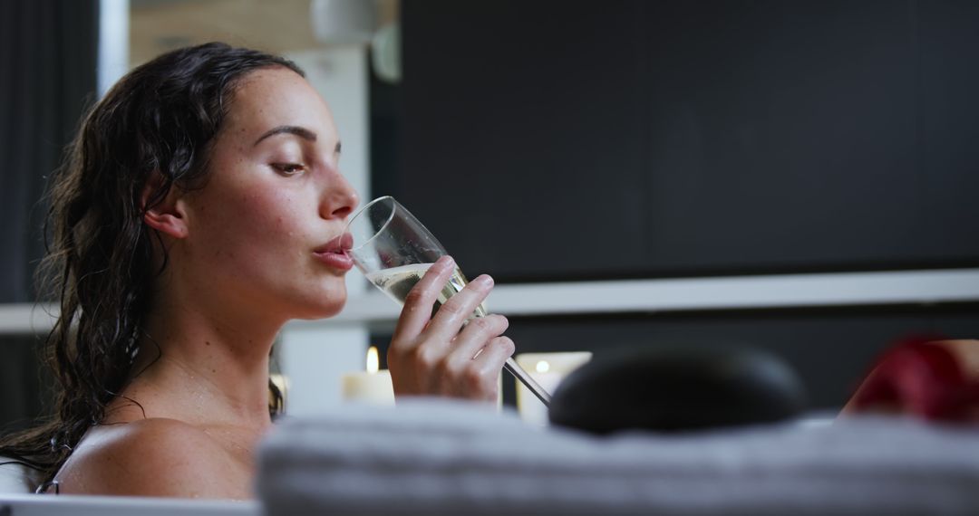 Woman Relaxing in Bathtub Drinking Champagne - Free Images, Stock Photos and Pictures on Pikwizard.com