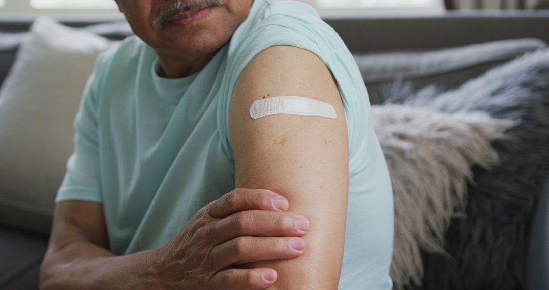 Senior Receiving Vaccination, Arm Bandaged After Injection - Free Images, Stock Photos and Pictures on Pikwizard.com