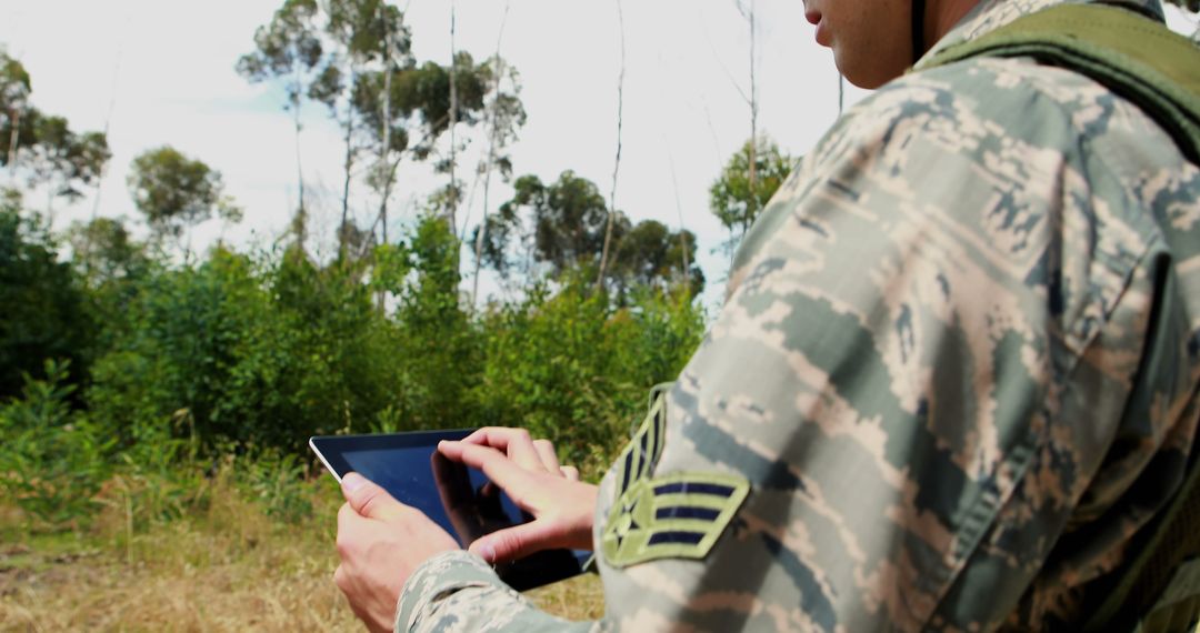 Military Personnel Using Tablet in Natural Environment