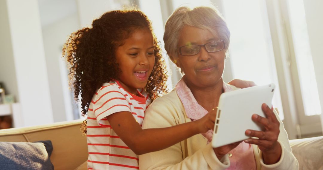 Grandmother and granddaughter using digital tablet - Free Images, Stock Photos and Pictures on Pikwizard.com