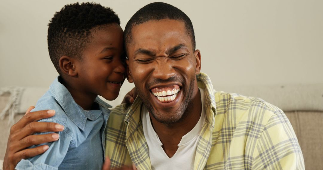 Joyful African American Father and Son Sharing a Laugh - Free Images, Stock Photos and Pictures on Pikwizard.com