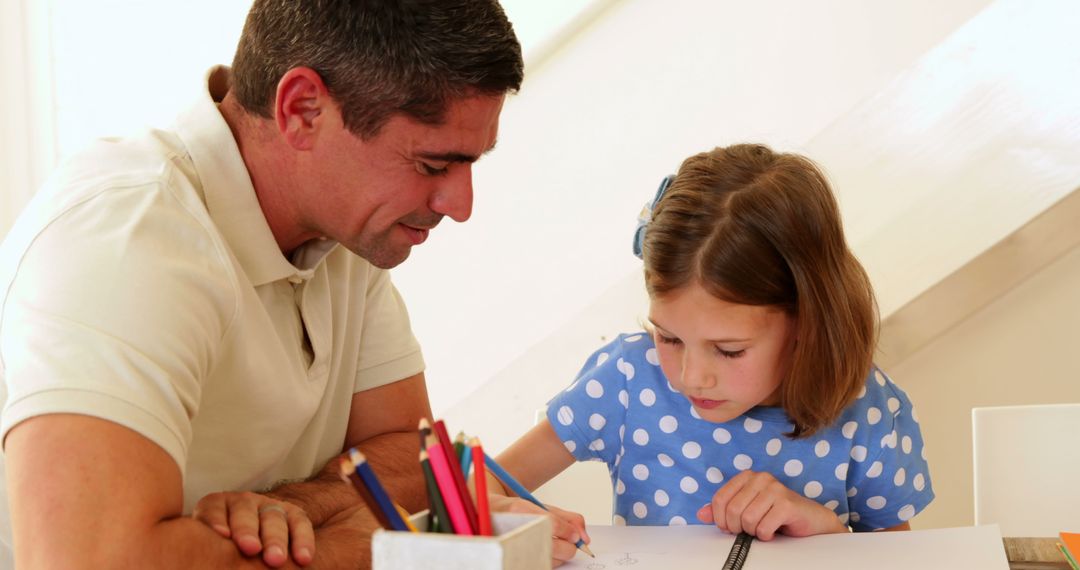 Father Helping Young Daughter with Homework at Home - Free Images, Stock Photos and Pictures on Pikwizard.com