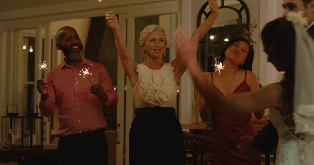 Bride and Groom Celebrate with Sparklers at Wedding Reception