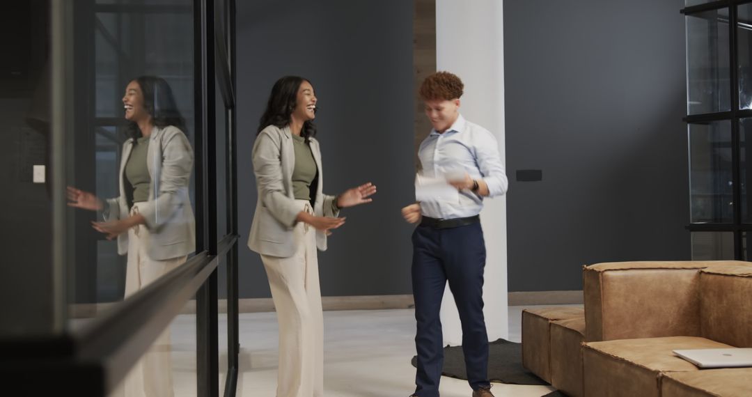 Diverse Colleagues Celebrating Achievement in Modern Office Setting