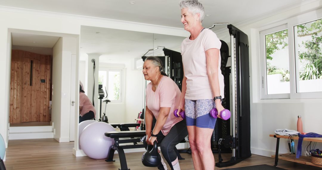 Senior Lesbian Couple Enjoying Home Exercise Routine with Weights