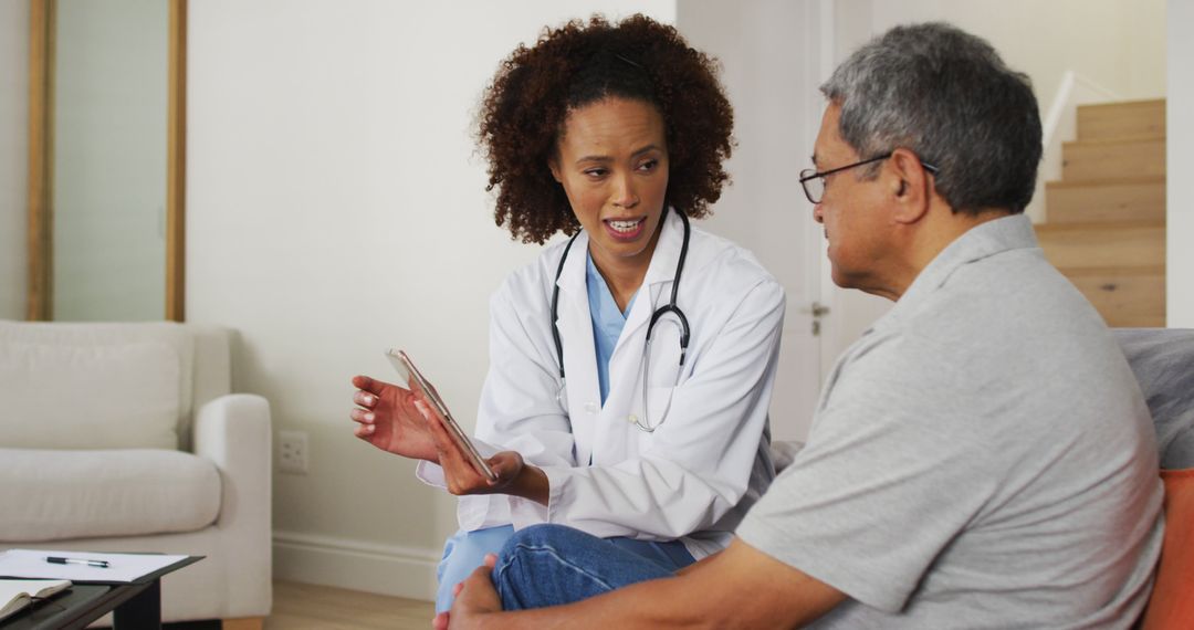 Doctor Discussing Health Information with Senior Patient at Home - Free Images, Stock Photos and Pictures on Pikwizard.com