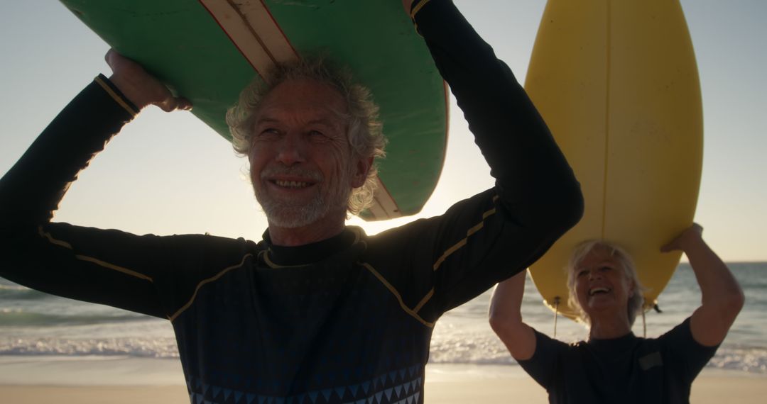 Senior Surfers Enjoying a Beach Day with Surfboards - Free Images, Stock Photos and Pictures on Pikwizard.com