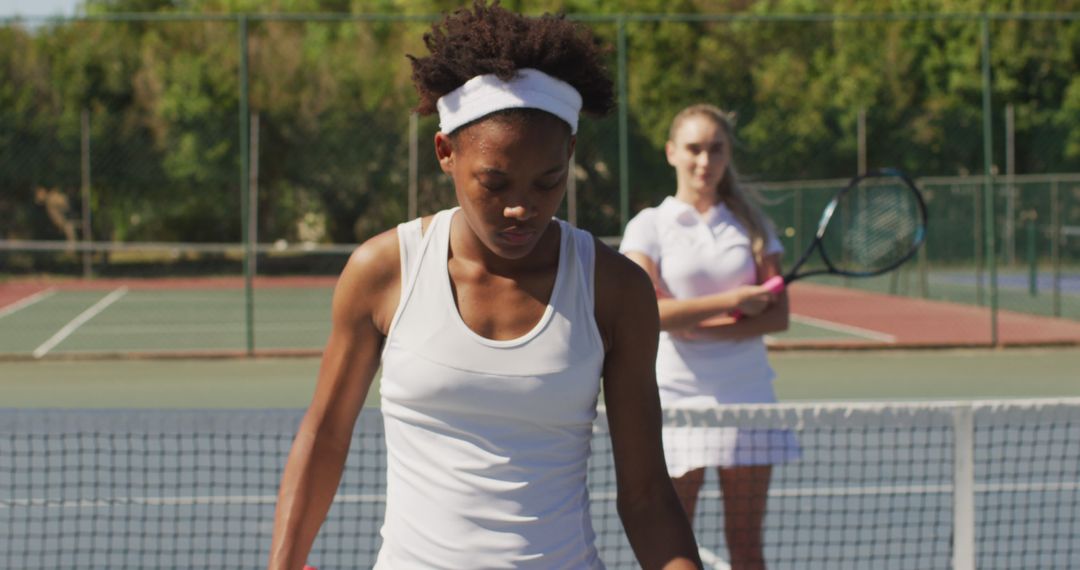 Female Tennis Players Staying Focused During Outdoor Match - Free Images, Stock Photos and Pictures on Pikwizard.com