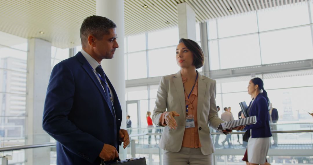 Business Executives Engaging in Modern Office Lobby