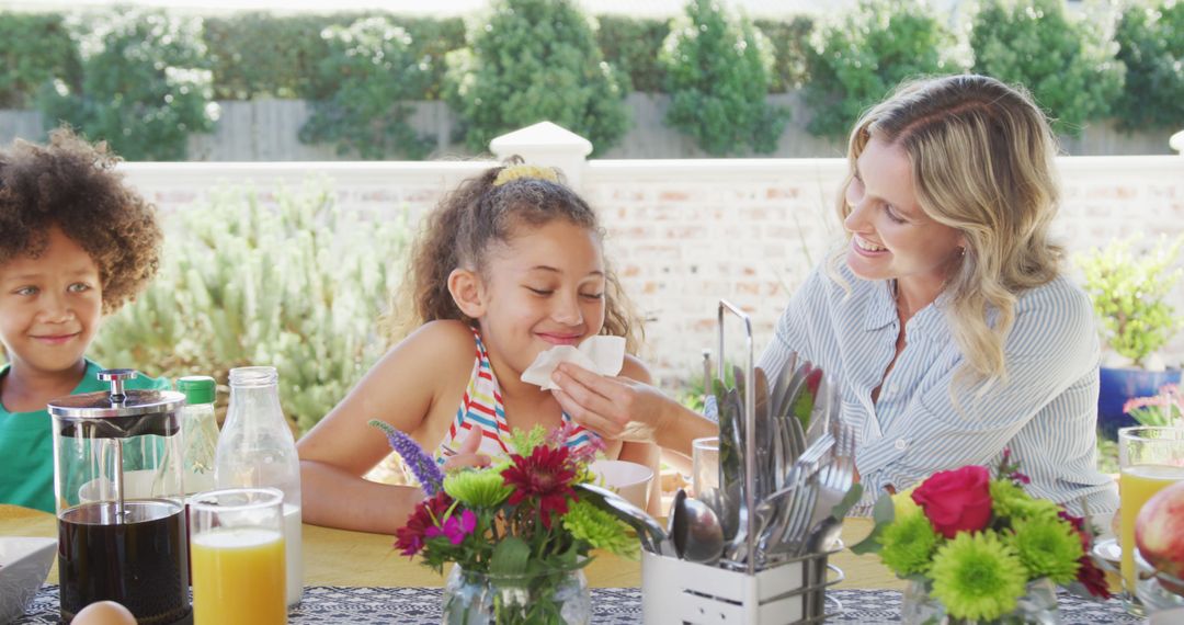 Image of diverse family spending time together and having dinner outside - Free Images, Stock Photos and Pictures on Pikwizard.com