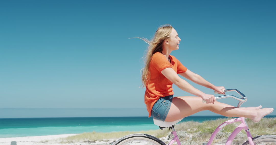 Young Woman Riding Bike on Beach in Summer - Free Images, Stock Photos and Pictures on Pikwizard.com