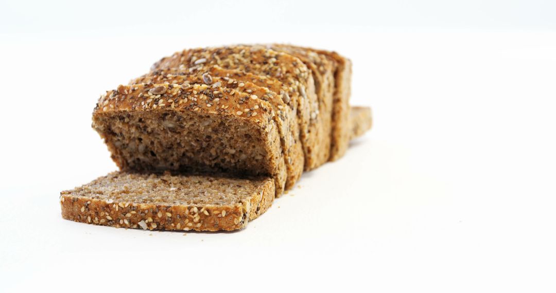 Sliced Whole Grain Bread on White Background - Free Images, Stock Photos and Pictures on Pikwizard.com