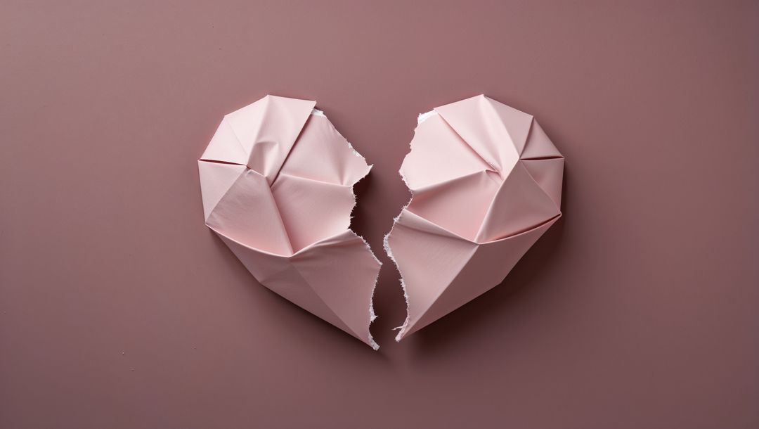 Torn Origami Heart Halves on Mauve Background