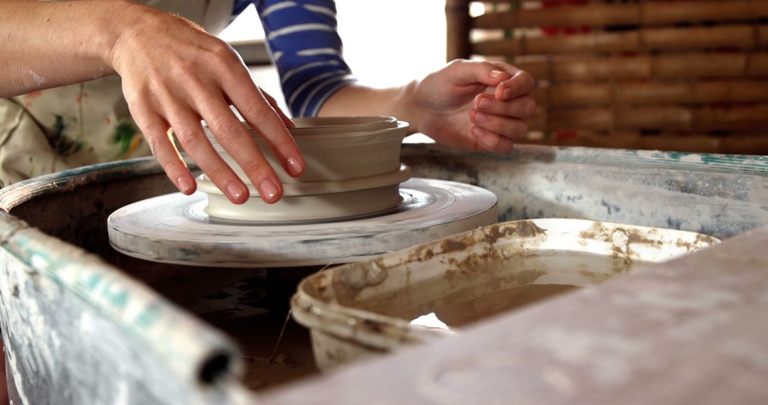 Hands Sculpting Clay on Pottery Wheel - Free Images, Stock Photos and Pictures on Pikwizard.com