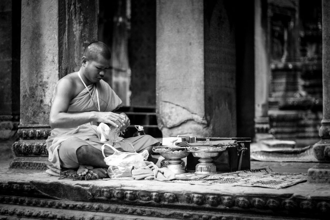 Monk Preparing Ritual Items in Ancient Temple - Free Images, Stock Photos and Pictures on Pikwizard.com