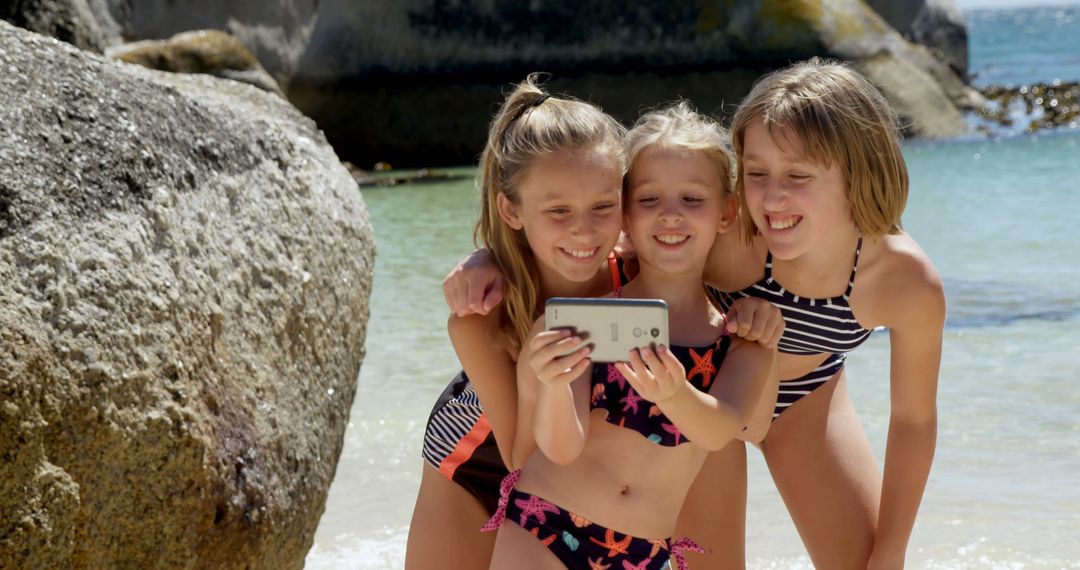 Cheerful Girls Taking Selfie on Sunny Beach Vacation - Free Images, Stock Photos and Pictures on Pikwizard.com