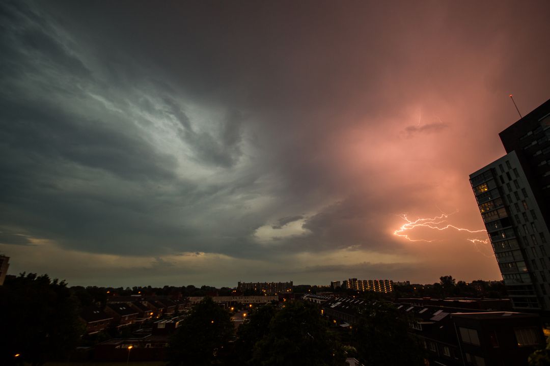 Dramatic Lightning Against Stormy Skyline at Sunset - Free Images, Stock Photos and Pictures on Pikwizard.com