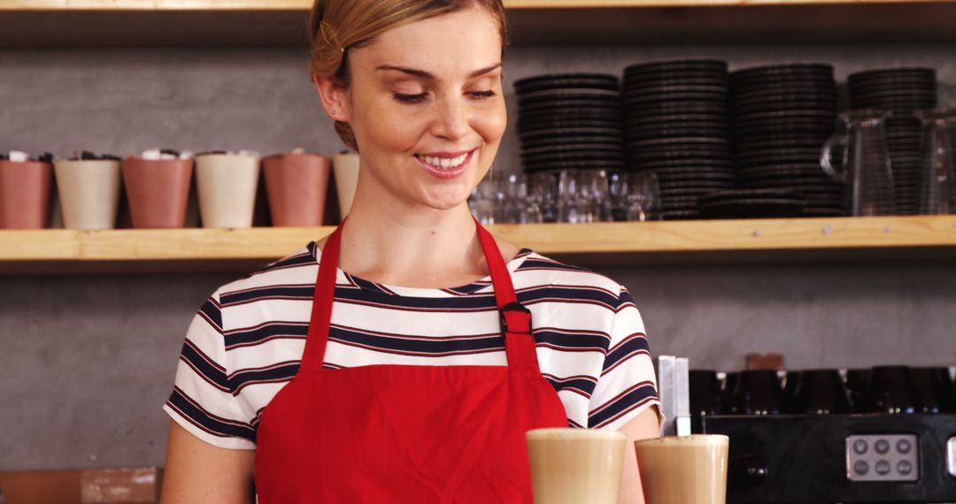 Smiling Barista Serving Freshly Made Coffees - Free Images, Stock Photos and Pictures on Pikwizard.com