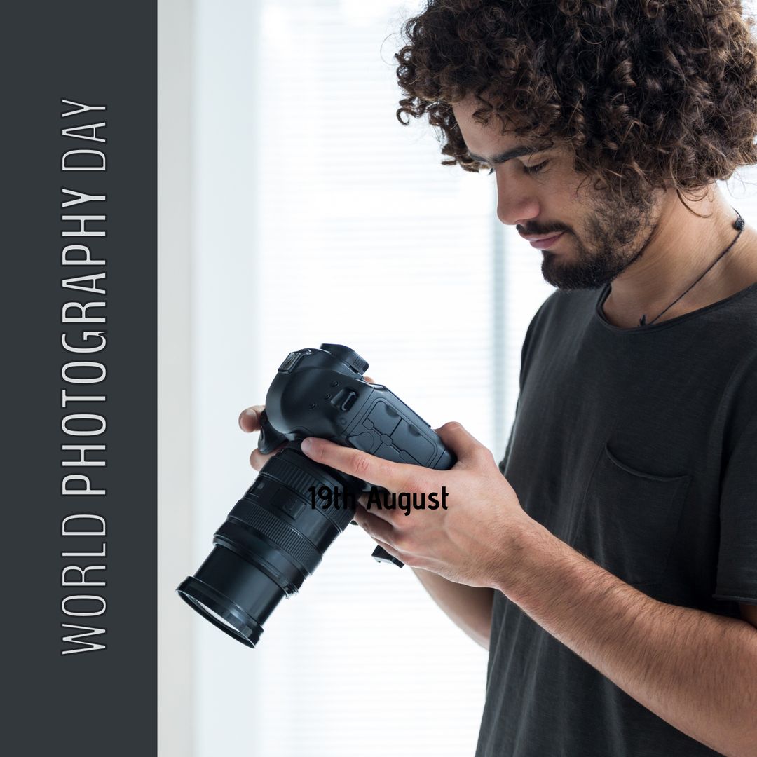 Young Man Examines DSLR Camera for World Photography Day