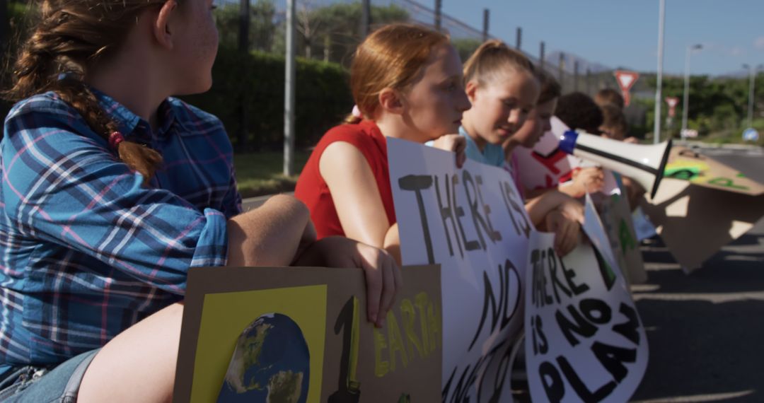 Children Protesting Environmental Issues Holding Posters Outdoors - Free Images, Stock Photos and Pictures on Pikwizard.com