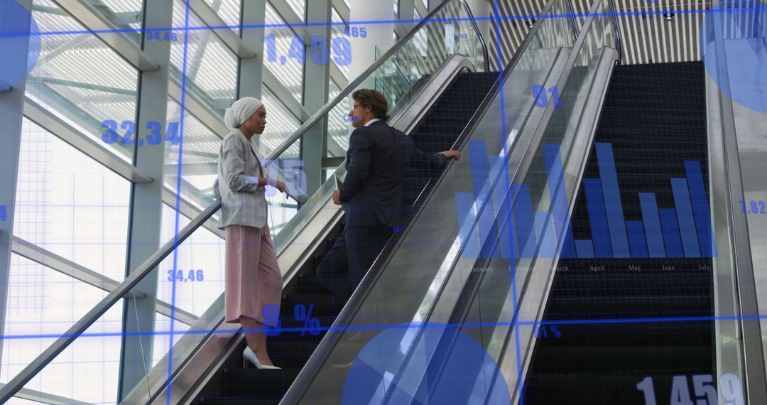 Business Professionals Analysing Digital Data on Office Escalator