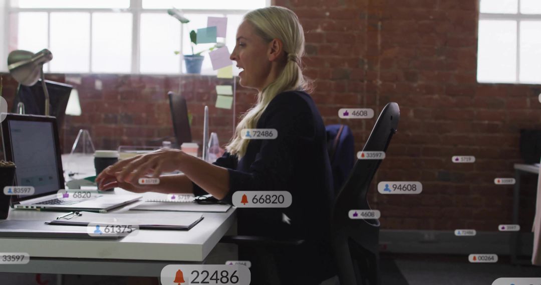 Professional Analyzing Data on Laptop in Modern Office Environment