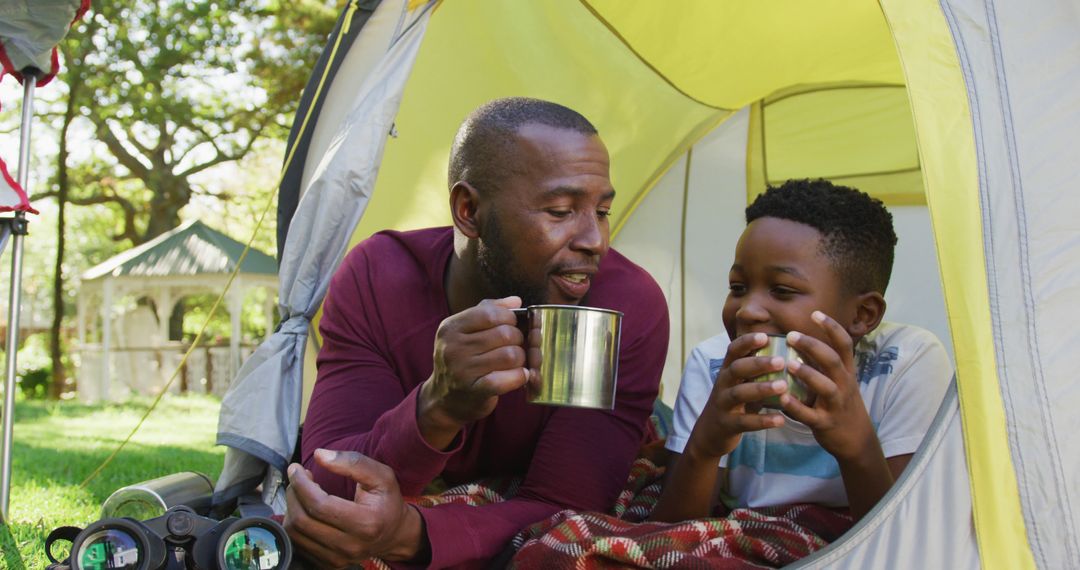 Father and Son Enjoying Coffee in Garden Tent - Free Images, Stock Photos and Pictures on Pikwizard.com