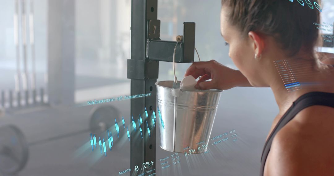Athlete reaching for chalk bucket while preparing for lift, gym training with data overlay