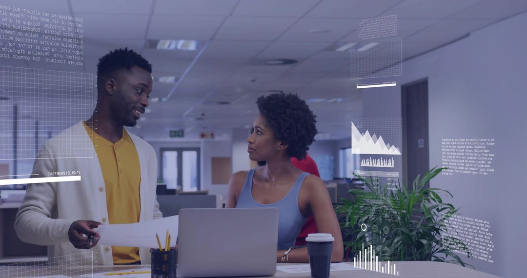 Collaborating Professionals Analyzing Data at Modern Workspace