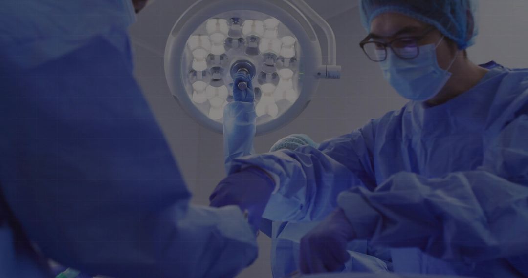 Surgeons Performing Precise Operation Under Surgical Light