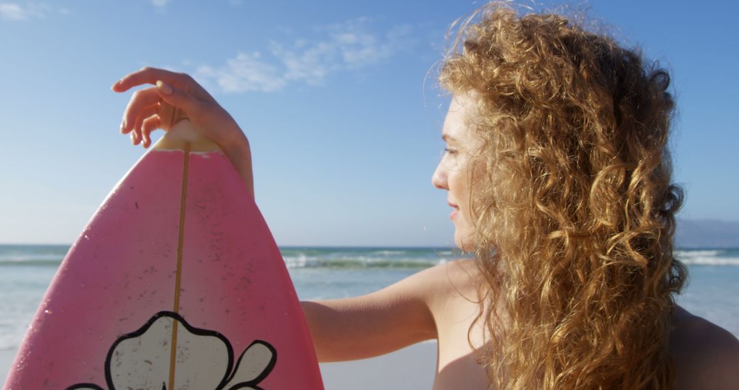 Young Woman Holding Surfboard at Beach - Free Images, Stock Photos and Pictures on Pikwizard.com