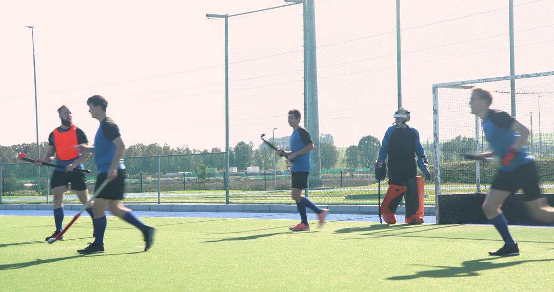 Male Field Hockey Players Practicing on Synthetic Turf