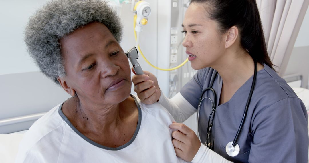 Healthcare Professional Examining Patient with Otoscope - Free Images, Stock Photos and Pictures on Pikwizard.com