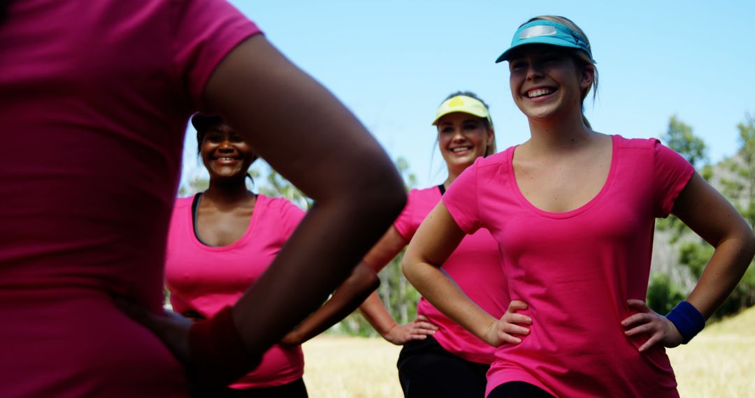 Group of Friends Smiling Outdoors in Matching Pink Shirts - Free Images, Stock Photos and Pictures on Pikwizard.com