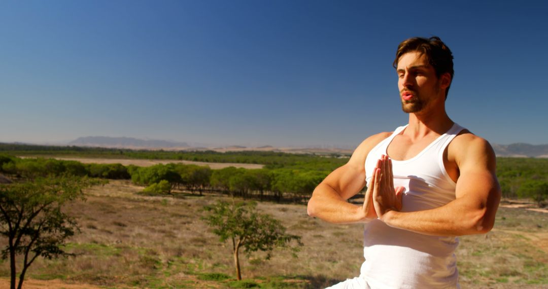 Man Practicing Yoga Outdoors in Scenic Nature - Free Images, Stock Photos and Pictures on Pikwizard.com