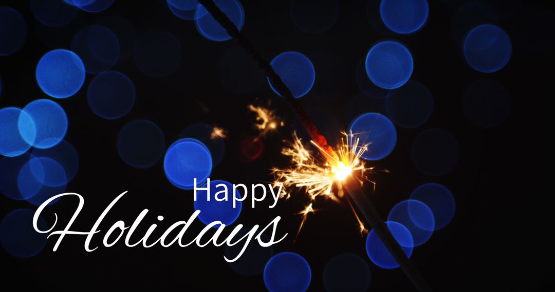 Festive Sparkler with Message Against Blue Light Bokeh