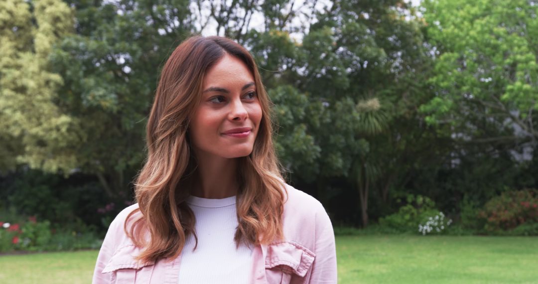 Woman Enjoying Tranquil Moment in Lush Garden